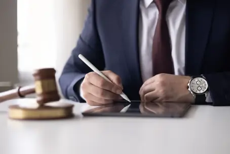 lawyer examining and signing legal documents